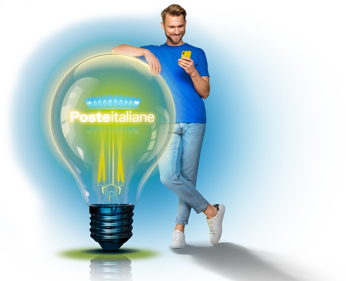 Uomo giovane con smartphone in mano appoggiato ad una lampadina